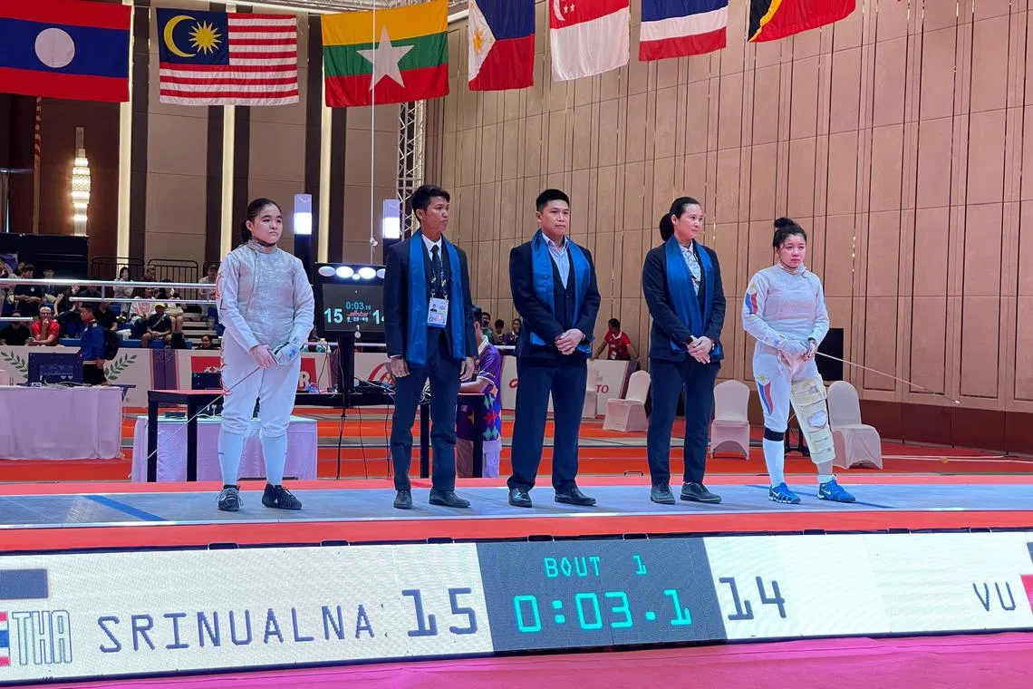 Singapore's Maxine Wong (far left) and her opponent Samantha Catantan of the Philippines ahead of the women's foil final at the SEA Games. Wong won via walkover.