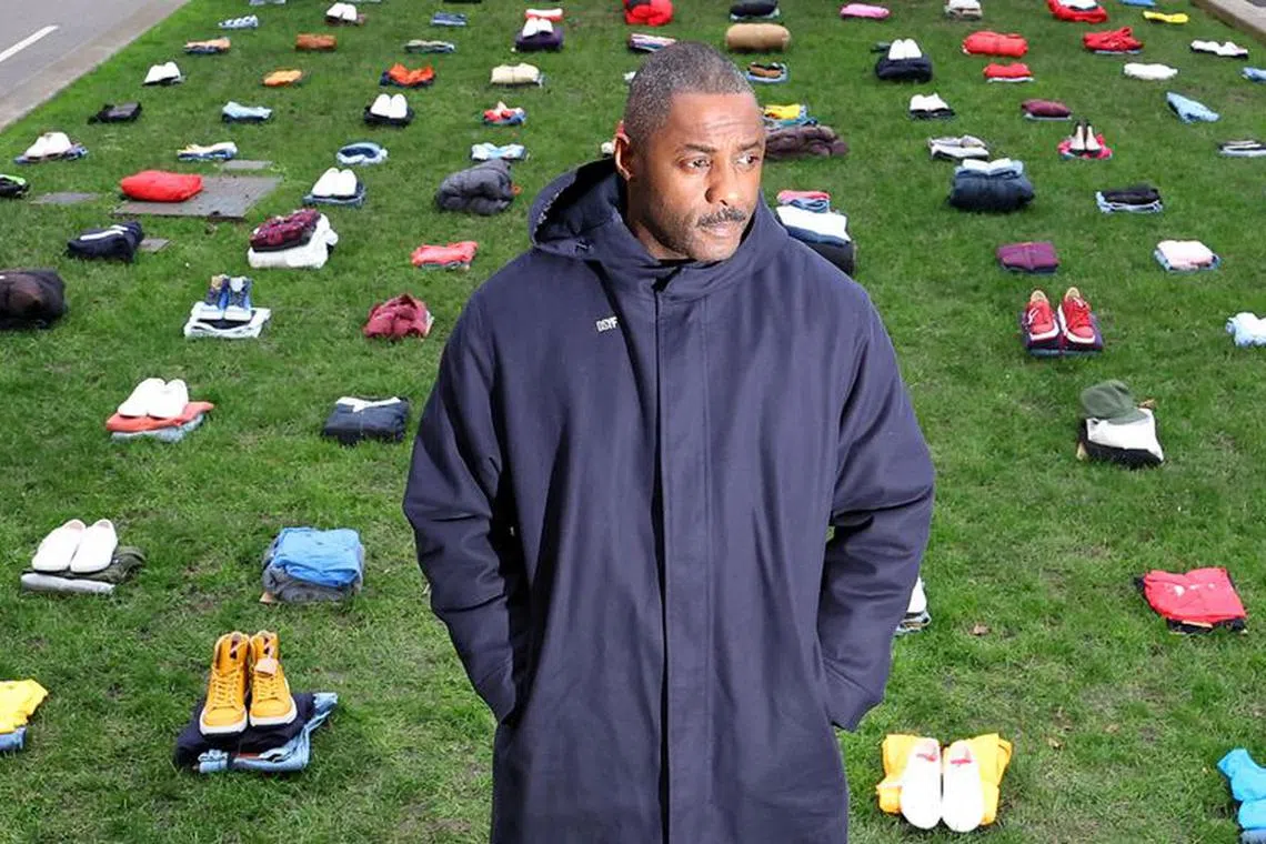 British actor Idris Elba stands in front of a display of clothing representing individual victims as he highlights an anti-knife crime campaign, near the Houses of Parliament in London, Britain, January 8, 2024. REUTERS/Toby Melville