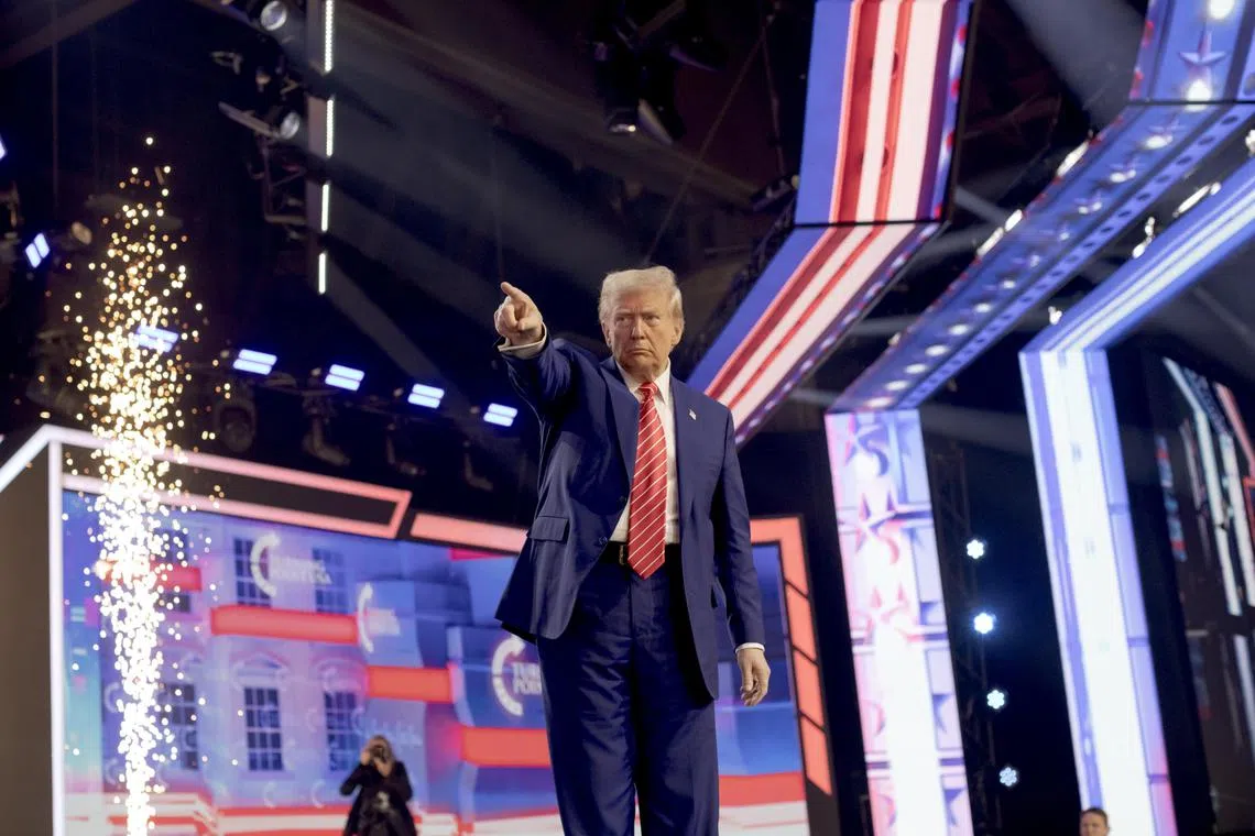 US President-elect Donald Trump takes the stage at Turning Point USA's AmericaFest 2024 at the Phoenix Convention Center in Phoenix on Dec 22.