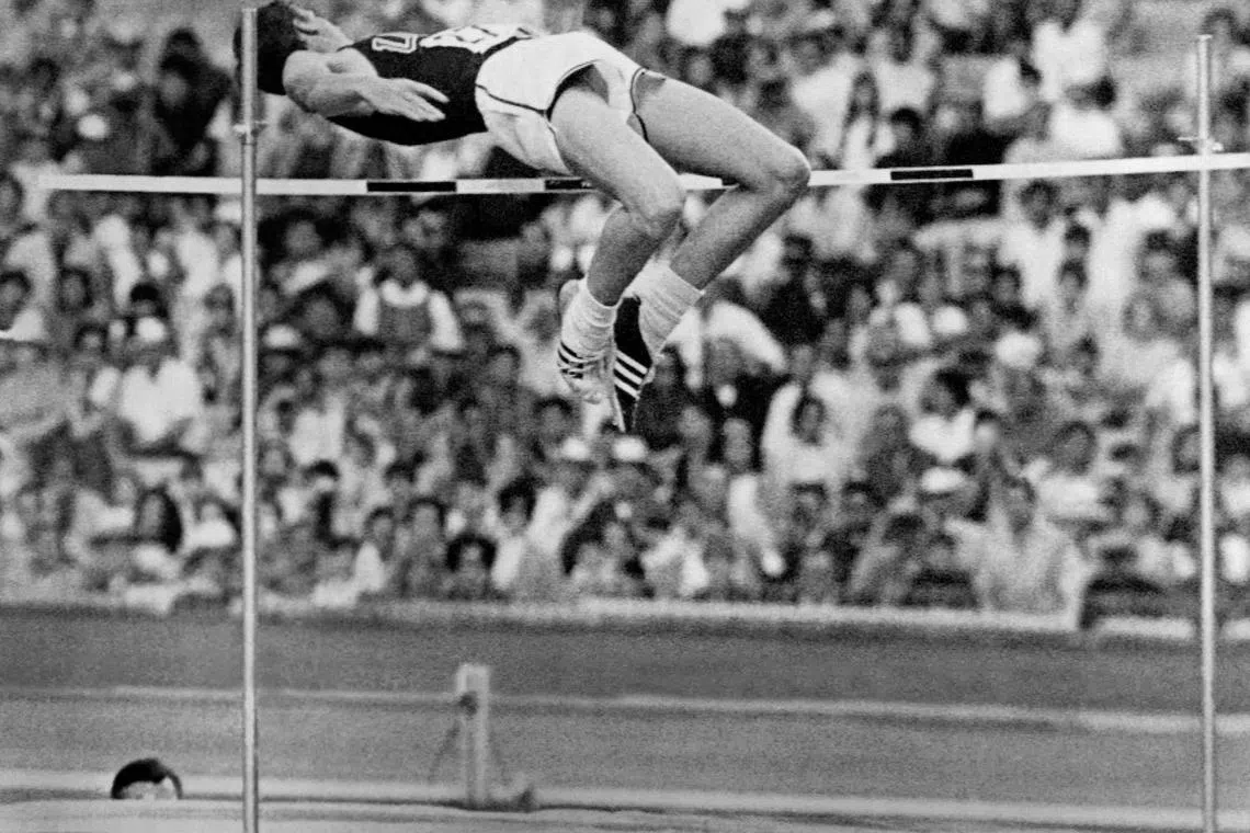 In this file photograph taken on October 20, 1968, United States' Dick Fosbury competes in the men's high jump final and wins the gold medal with a brand new style of jumping at the Mexico Olympic Games.