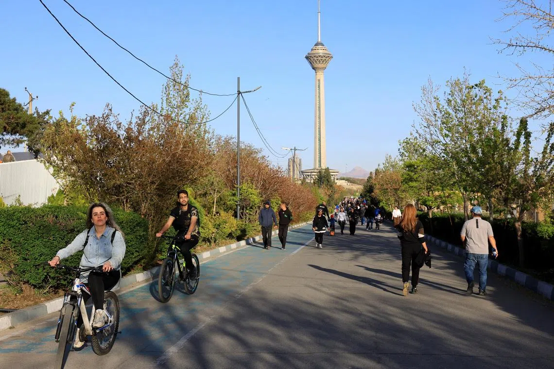 Iranians enjoy a sunny day in a public park, amid a two-week ceasefire in the US-Israeli conflict with Iran, in Tehran.