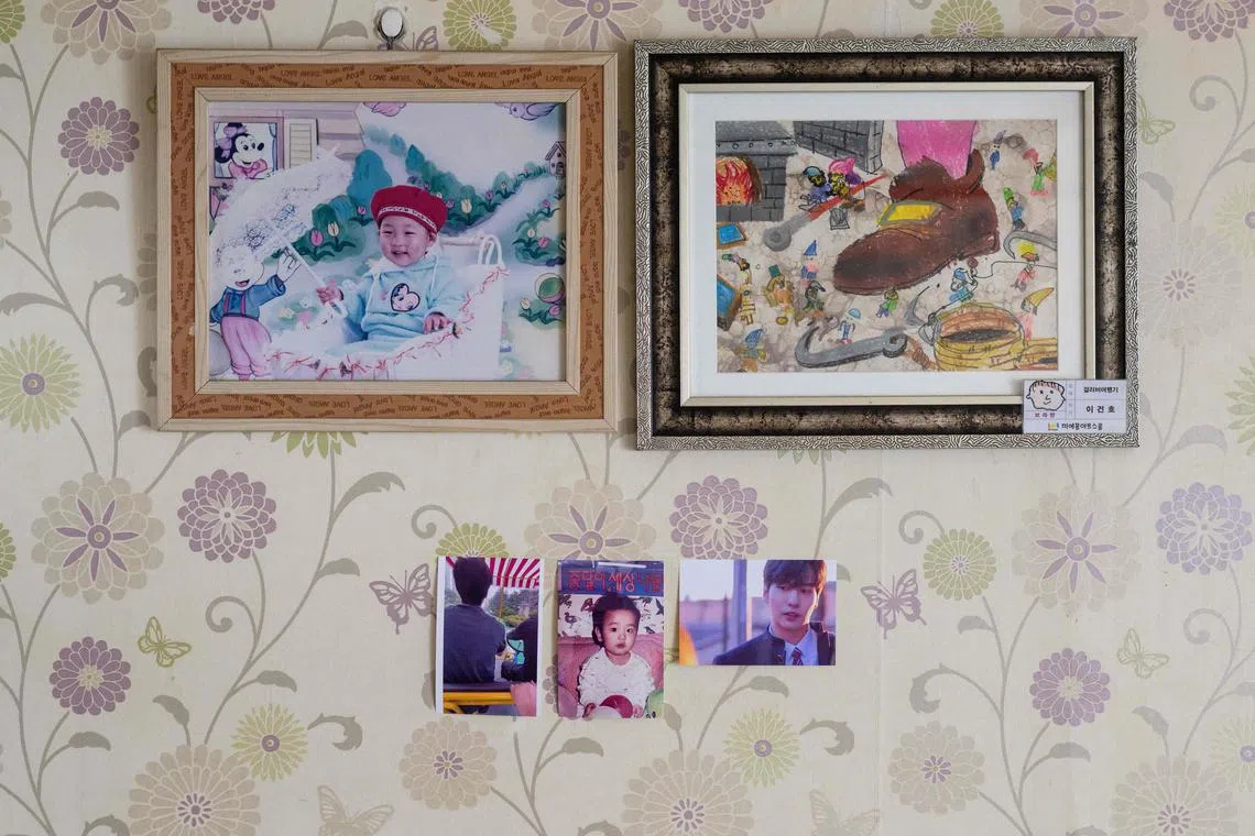 Photos of Lee Ji-han, who was killed aged 24 during a Halloween crowd crush in the popular Itaewon district in October last year, are displayed at his family home in Seoul on March 20.