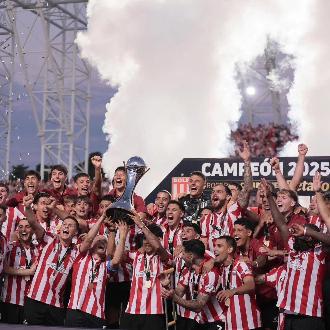 Estudiantes players celebrate winning the Champions Trophy final against Club Atletico Platense at the Unico de San Nicolas stadium in Argentina on Dec 20, 2025.