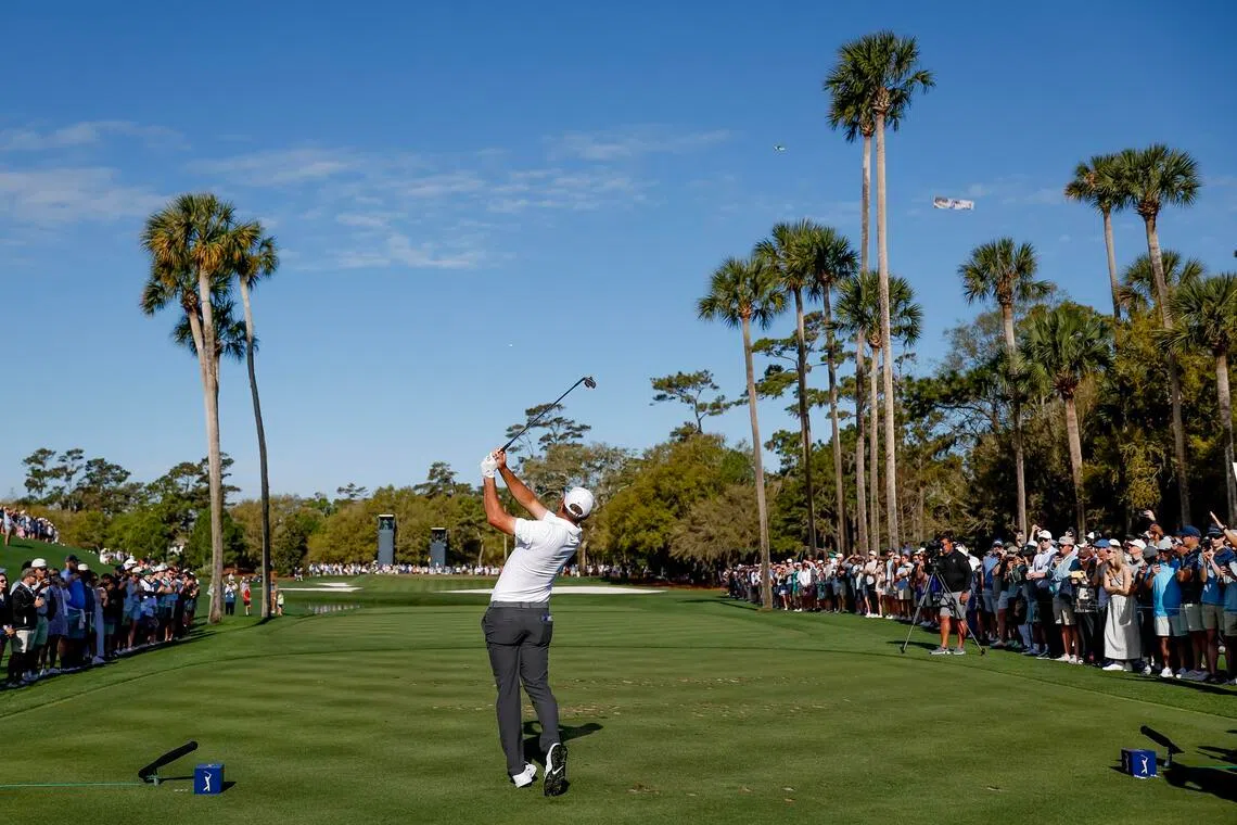 Scottie Scheffler of the US tees the third hole during the third round of The Players Championship, on March 14.
