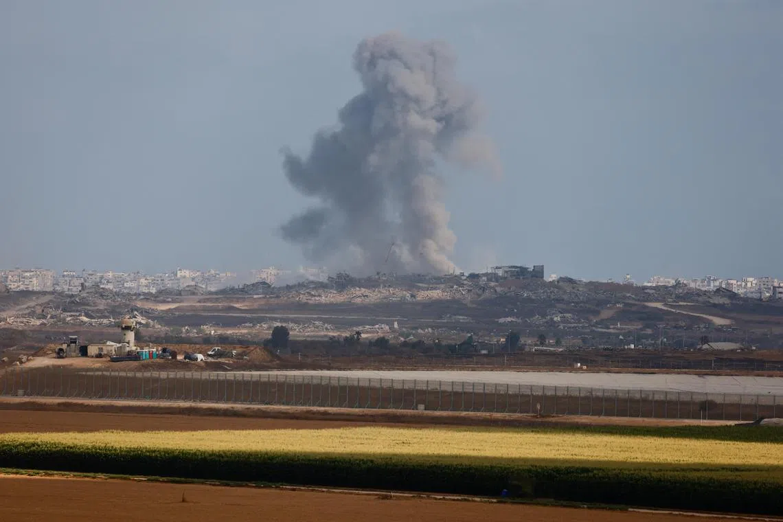 Smoke rises following an explosion in Gaza, as seen from the Israeli side of the Israel-Gaza border, July 13, 2025. REUTERS/Amir Cohen