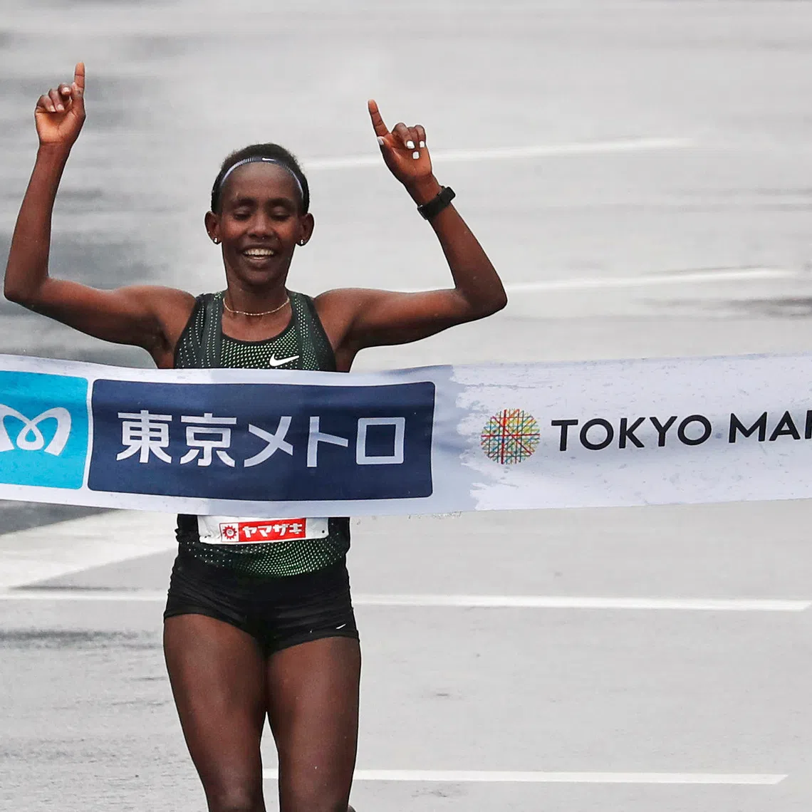 FILE PHOTO: Athletics - Tokyo Marathon 2019 - Tokyo, Japan - 03/03/19 - Women's winner Ruti Aga of Ethiopia crosses the finish line.    REUTERS/Issei Kato/File Photo
