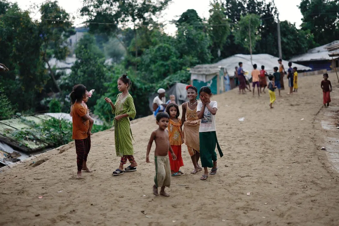 Rohingya refugee children roam on a road at the Kutupalong refugee camp in Cox's Bazar, Bangladesh, June 25, 2024. REUTERS/Mohammad Ponir Hossain/File Photo