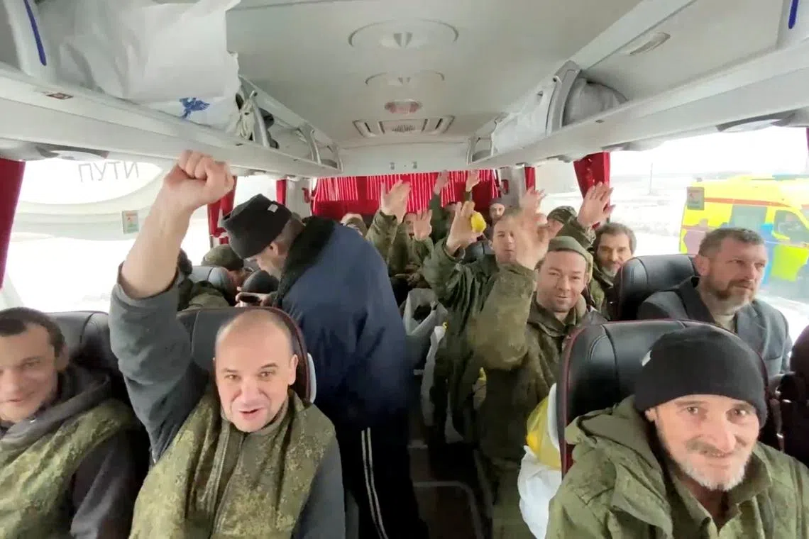 A still from a video released on Feb 4 by Russia's Defence Ministry, shows what it said to be captured Russian prisoners of war in a bus.