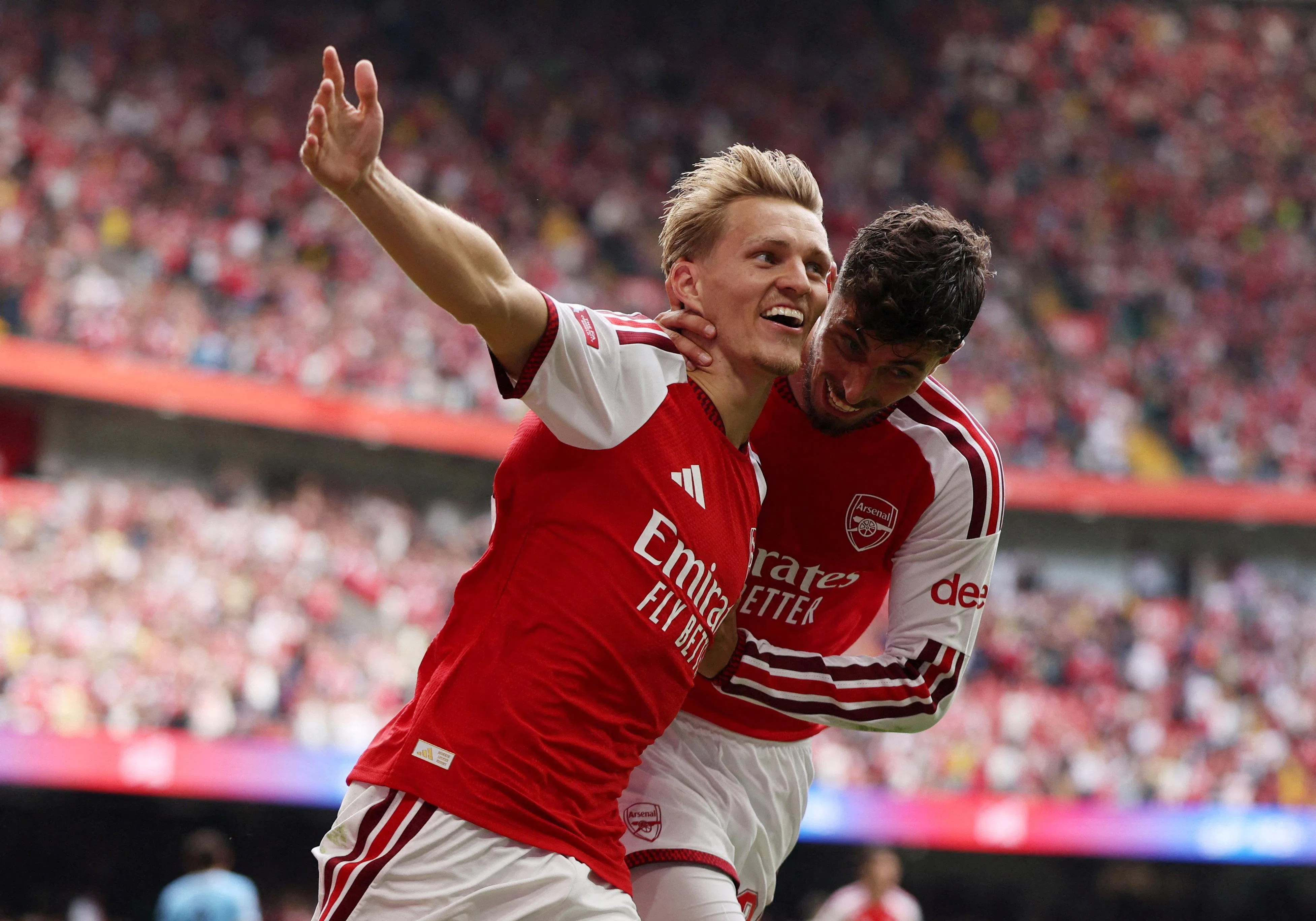 Soccer Football - FA Community Shield - Arsenal v Manchester City - Principality Stadium, Cardiff, Wales, Britain - August 16, 2026
Arsenal's Martin Odegaard celebrates scoring their third goal with Kai Havertz REUTERS/Chris Radburn     TPX IMAGES OF THE DAY