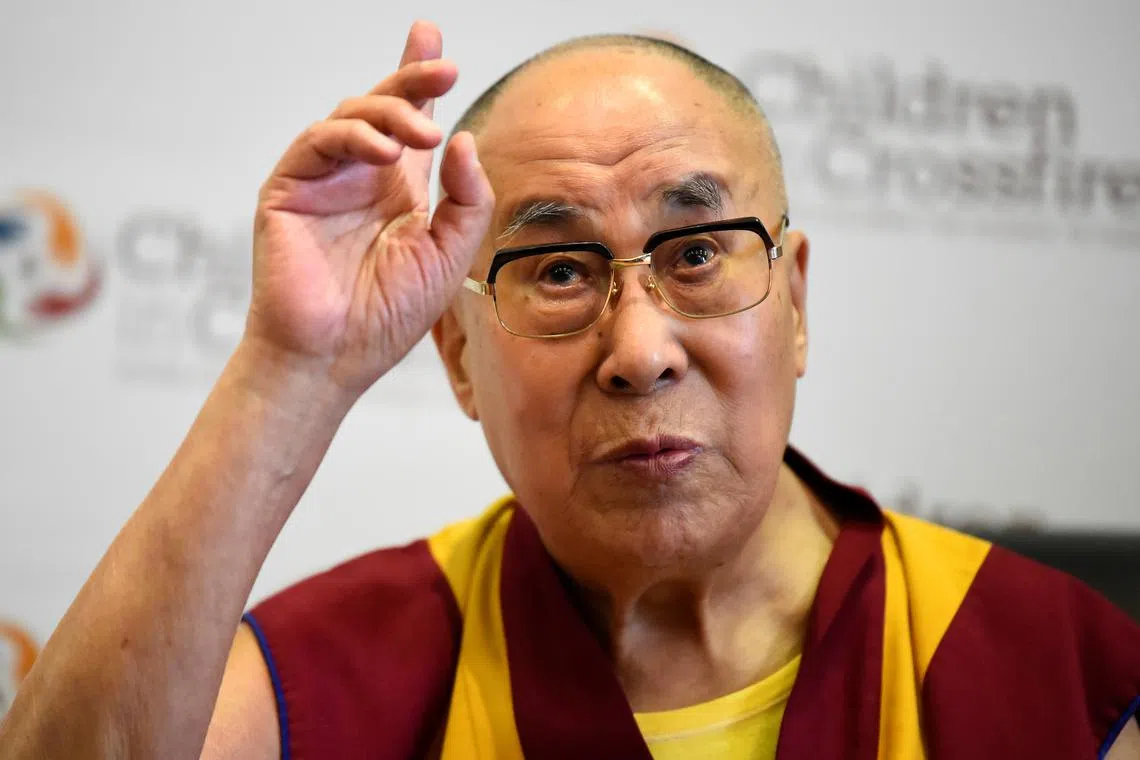 FILE PHOTO: Tibetan spiritual leader the Dalai Lama, Patron of Children in Crossfire, gestures during a press conference in Londonderry, Northern Ireland September 11, 2017. REUTERS/Clodagh Kilcoyne/File Photo