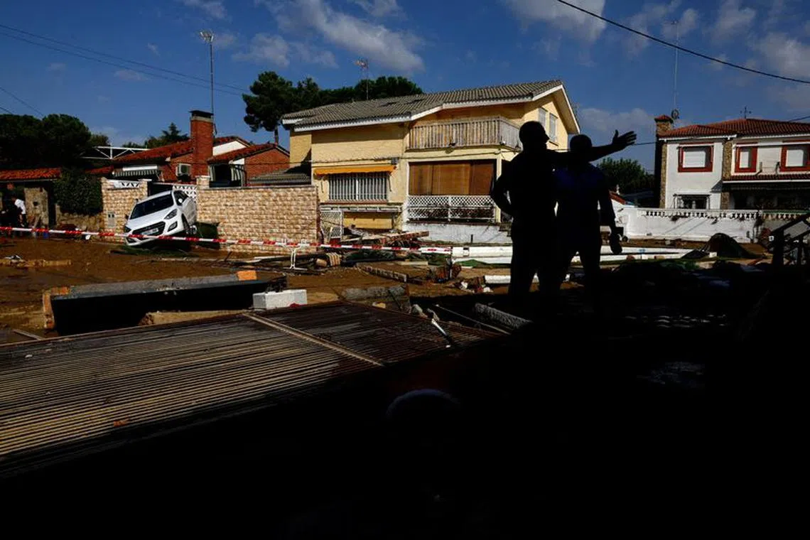 David Fernandez, 52, shows damage on the homes of his parents and their neighbours following heavy rain, in El Alamo, Spain September 4, 2023. REUTERS/Susana Vera