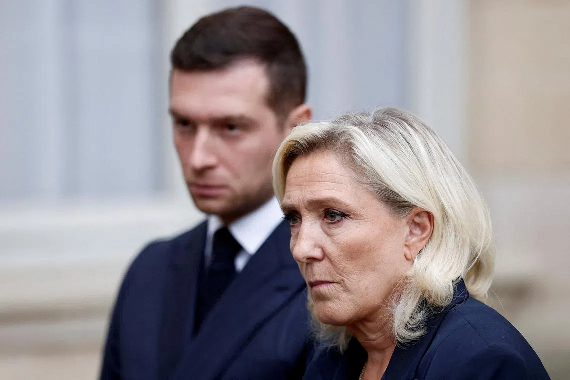 FILE PHOTO: Jordan Bardella, president of the French far-right National Rally (Rassemblement National - RN) political party, and French far-right leader and member of parliament Marine Le Pen talk to journalists as they leave after a meeting with the French Prime Minister at the Hotel Matignon in Paris, France, September 2, 2025. REUTERS/Benoit Tessier/File Photo