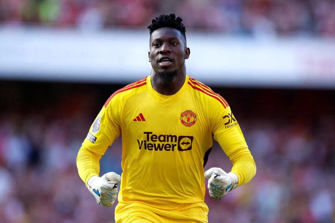 FILE PHOTO: Soccer Football - Premier League - Arsenal v Manchester United - Emirates Stadium, London, Britain - September 3, 2023  Manchester United's Andre Onana celebrates after Marcus Rashford scores their first goal Action Images via Reuters/John Sibley/File photo