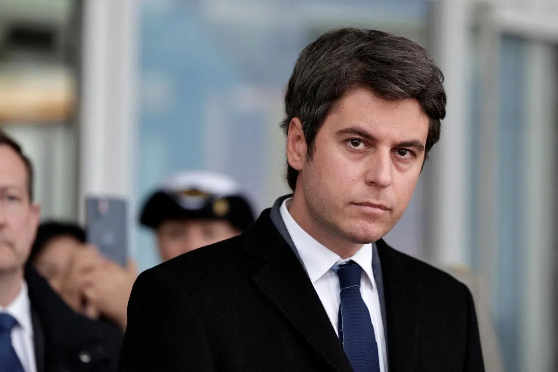 FILE PHOTO: France's Prime Minister Gabriel Attal waits to greet China's President Xi Jinping and his wife, as they arrive for a two-day state visit, at Orly airport, south of Paris, France on May 5, 2024.     STEPHANE DE SAKUTIN/Pool via REUTERS/File Photo