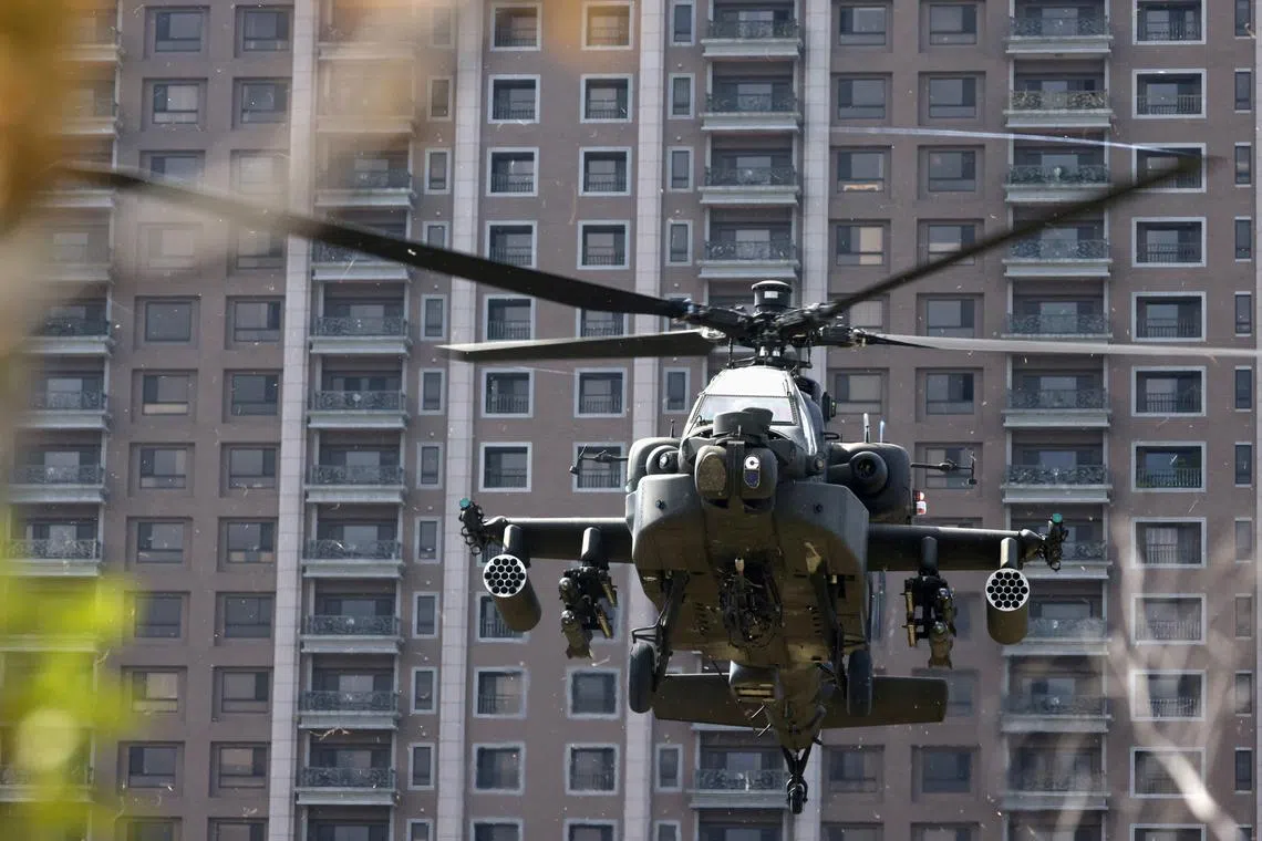 FILE PHOTO: An AH-64E Apache attack helicopter lands during 'Combat Readiness Week' drills in Hsinchu, Taiwan, October 29, 2020. REUTERS/Ann Wang/File Photo