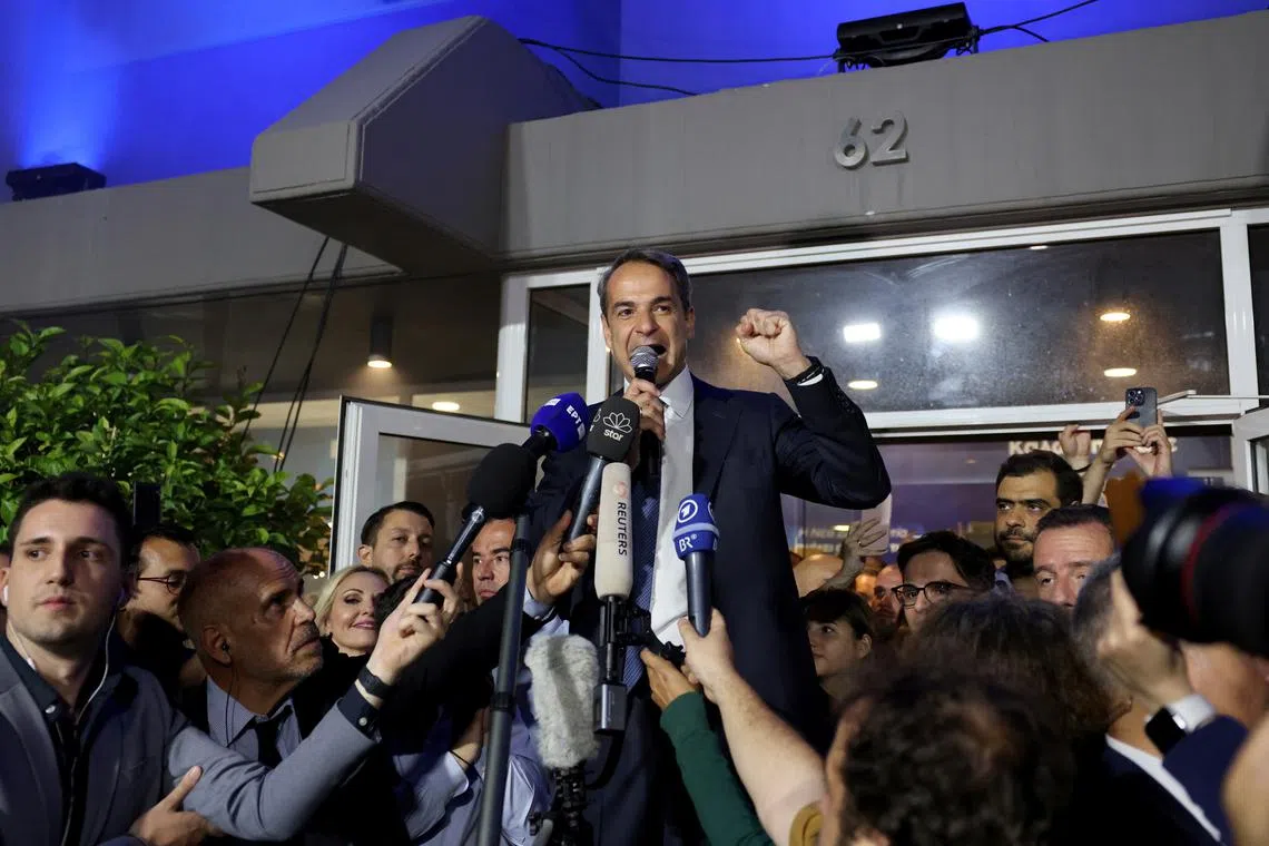 Greek Prime Minister and New Democracy conservative party leader Kyriakos Mitsotakis speaks outside the party's headquarters in Athens, on May 21, 2023.