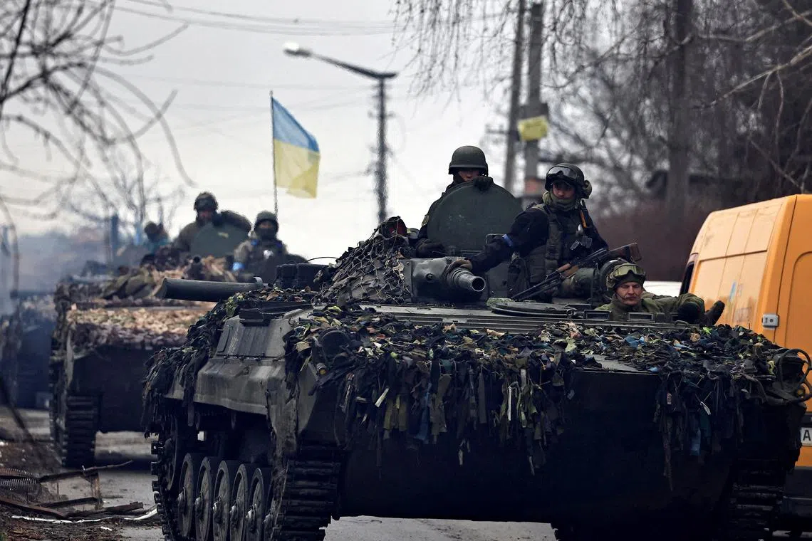 FILE PHOTO: Ukrainian soldiers are pictured in their tanks, amid Russia's invasion on Ukraine, in Bucha, in Kyiv region, Ukraine April 2, 2022. REUTERS/Zohra Bensemra/File Photo