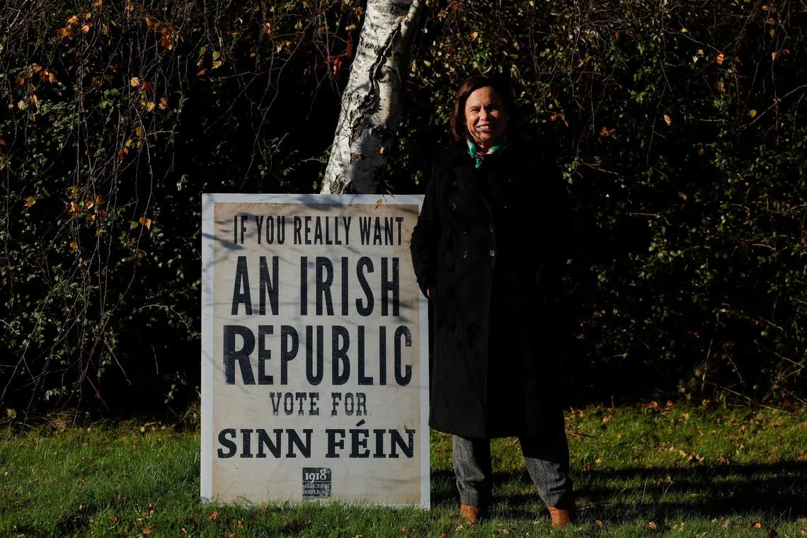 FILE PHOTO: Sinn Fein President and Leader of the Opposition Mary Lou McDonald stands next to a sign, as she campaigns ahead of Ireland's general election, in Naas, Ireland November 27, 2024. REUTERS/Clodagh Kilcoyne/File Photo
