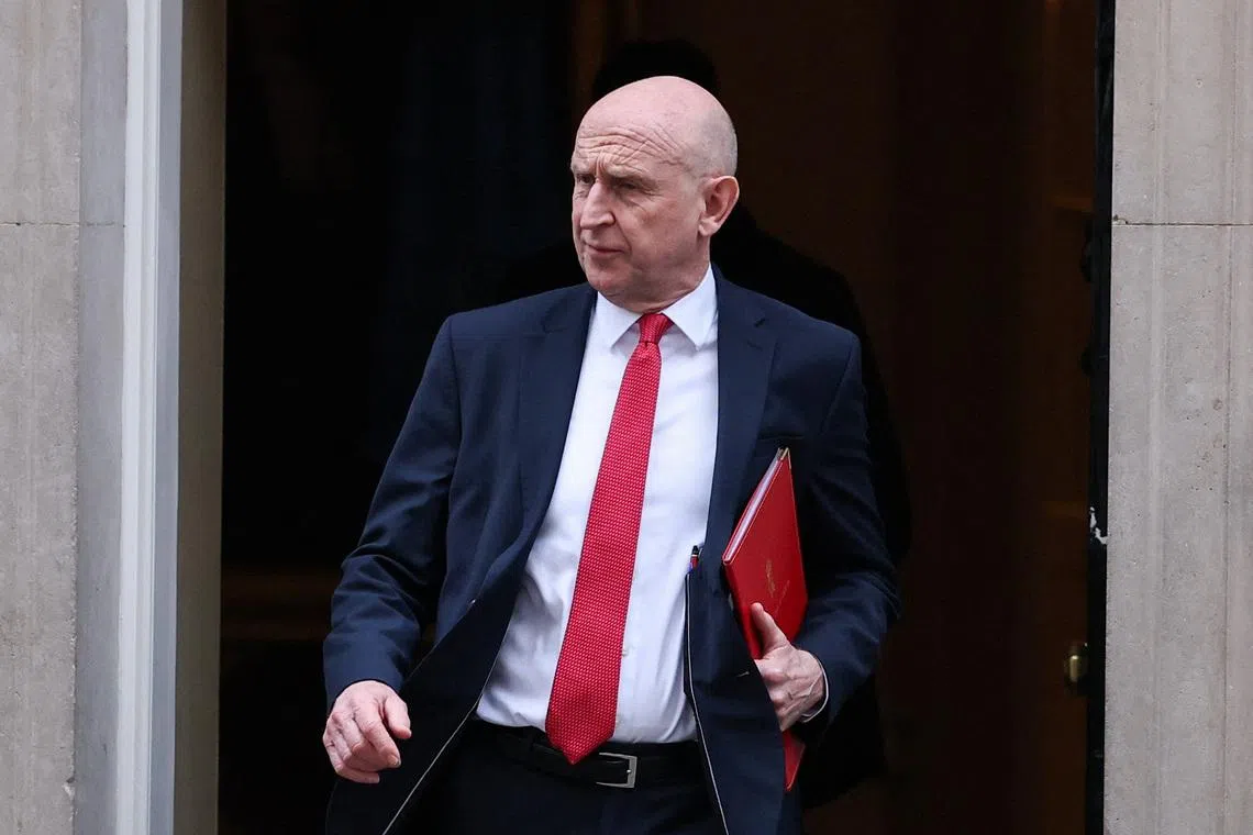 FILE PHOTO: British Defense Minister John Healey walks outside of 10 Downing Street, on the day of a cabinet meeting, following calls for Prime Minister Keir Starmer to step down after criticism of his appointment of Peter Mandelson as U.S. ambassador, after the release of new U.S. Justice Department files linked to the late financier and convicted sex offender Jeffrey Epstein, in London, Britain, February 10, 2026. REUTERS/Toby Melville/File Photo
