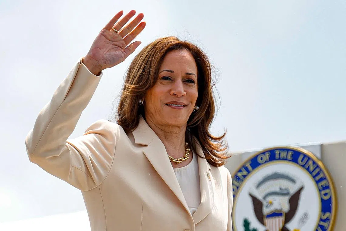 US Vice-President and Democratic Presidential candidate Kamala Harris waves as she boards Air Force Two at Indianapolis International Airport in Indianapolis, Indiana, on July 24, 2024. 