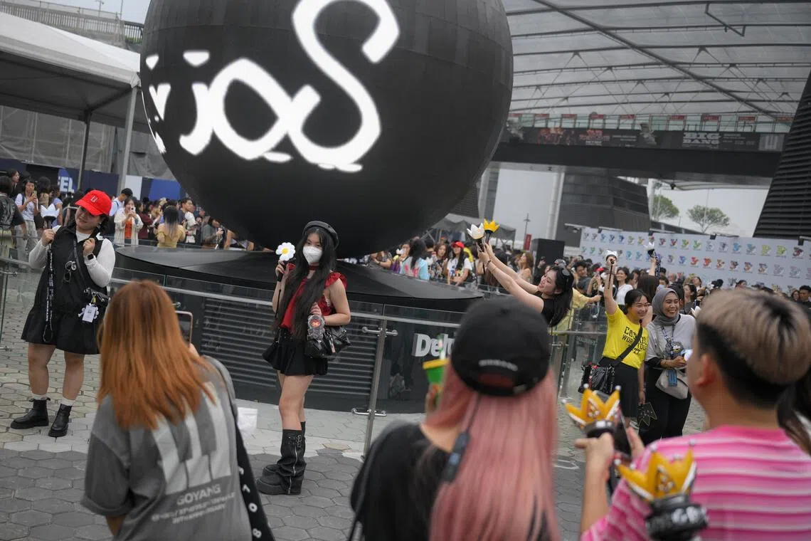 Concertgoers outside Stadium MRT station ahead of BigBang’s XX: Cosmos world tour on Oct 17.
