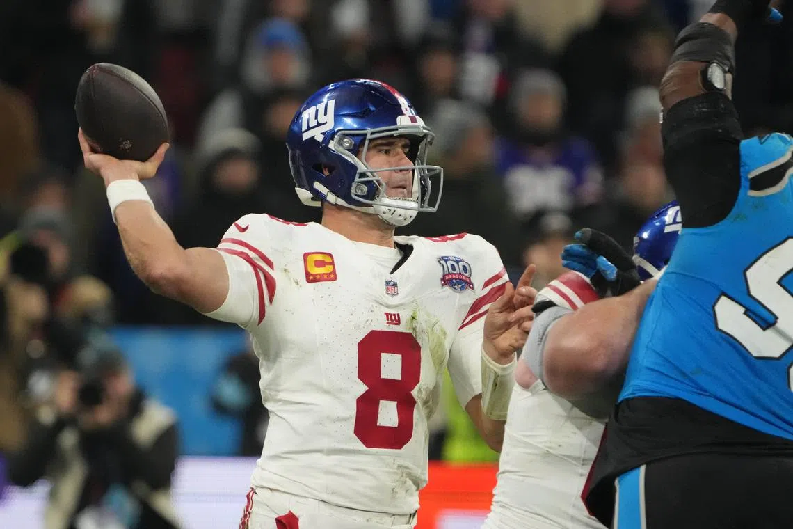FILE PHOTO: Nov 10, 2024; Munich, Germany; New York Giants quarterback Daniel Jones (8) throws the ball against the Carolina Panthers  in the second half during the 2024 NFL Munich Game at Allianz Arena. Mandatory Credit: Kirby Lee-Imagn Images/File Photo