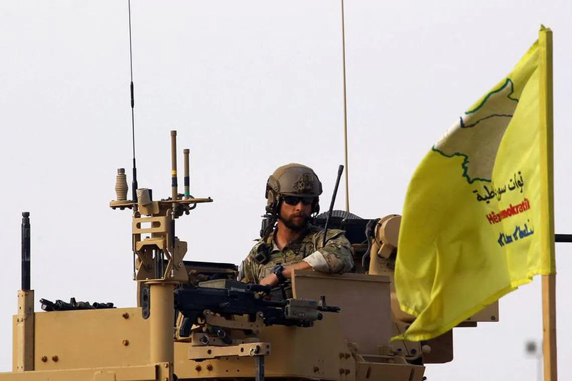 FILE PHOTO: An American soldier sits on a military vehicle, at al-Omar oil field in Deir Al Zor, Syria March 23, 2019. Picture taken March 23, 2019. REUTERS/Aboud Hamam/File Photo