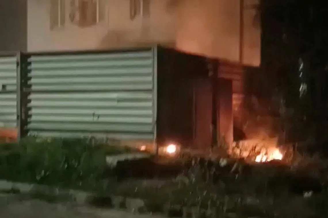 Smoke and flames rise from a building near the Archeda train station, amid the Russia-Ukraine conflict, in Frolovo, Volgograd region, Russia, in this screengrab obtained from a social media video released on August 4, 2025. Social media/via REUTERS