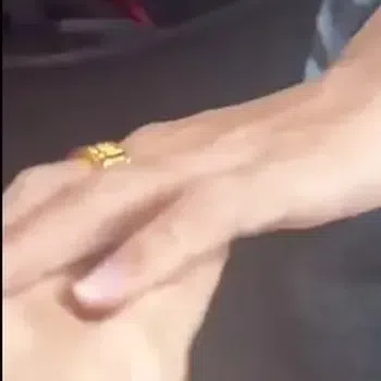 The passenger used her hand to protect herself from the driver’s grasp and then used the same hand to grip her clothing and did not respond.