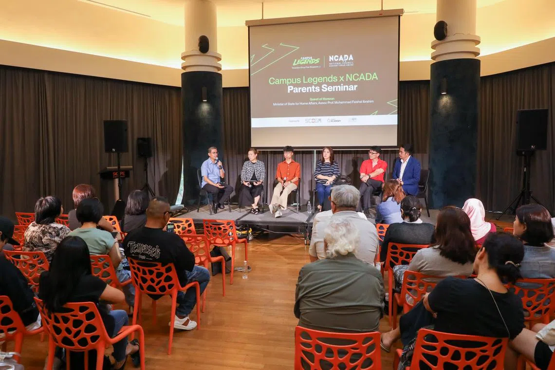 Minister of State for Home Affairs and National Development Muhammad Faishal Ibrahim (left) in a panel discussion at a seminar for parents on the harms of drug abuse on Aug 3.