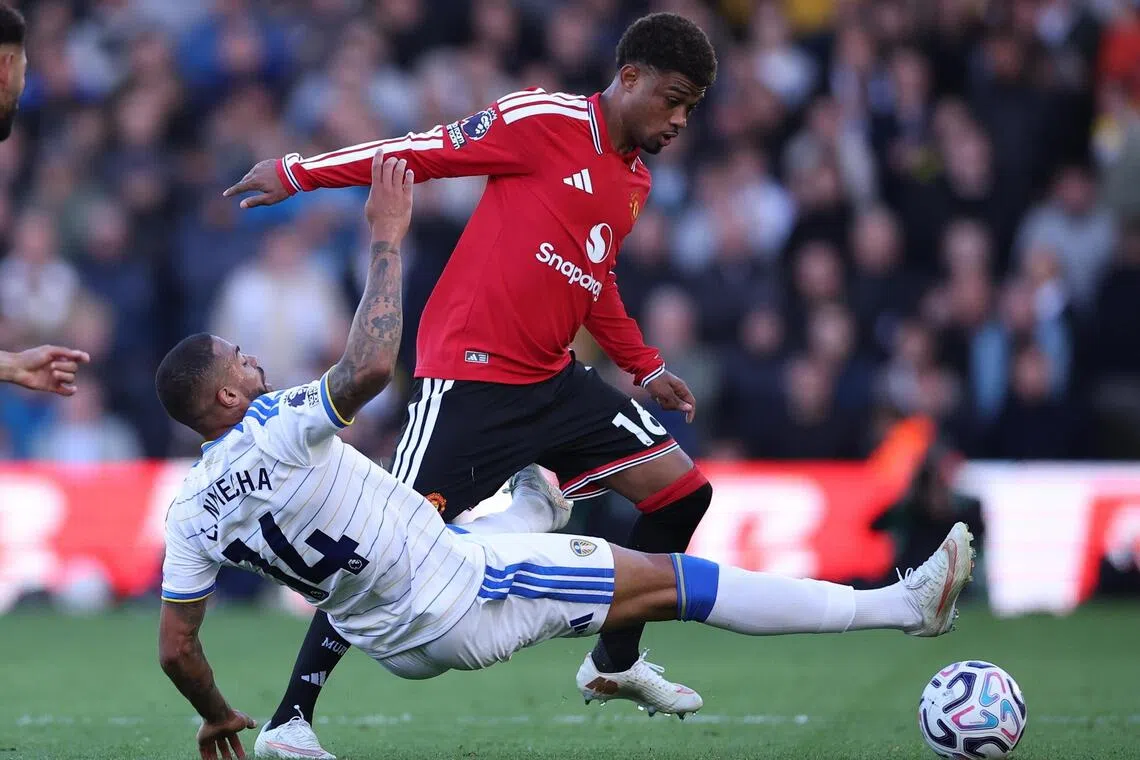 Lukas Nmecha of Leeds United trying to dispossess Amad Diallo of Manchester United in their English Premier League match on Oct 18 that ended 1-1.