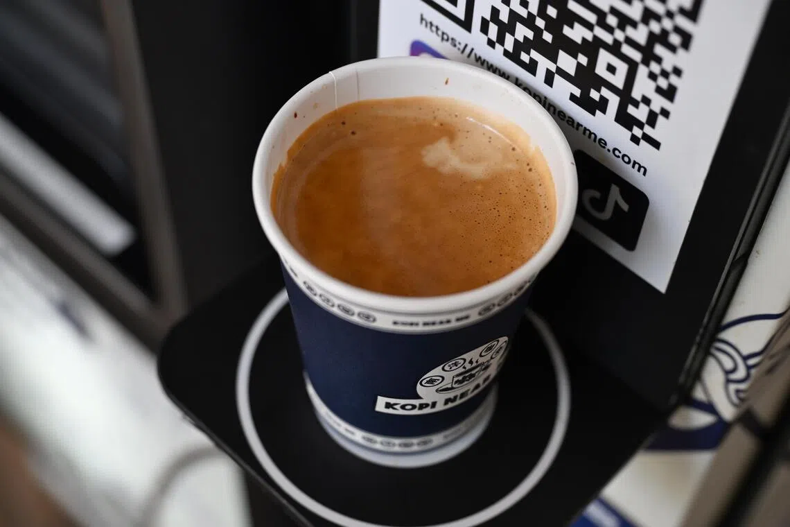 A cup of freshly brewed kopi from a Kopi Near Me vending machine at Ubi Techpark.