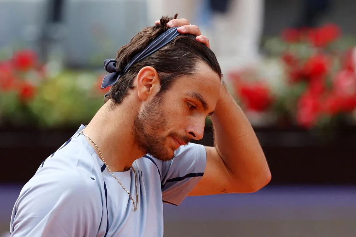 Tennis - Italian Open - Foro Italico, Rome, Italy - May 12, 2026 Italy's Lorenzo Musetti looks dejected after losing his round of 16 match against Norway's Casper Ruud REUTERS/Ciro De Luca