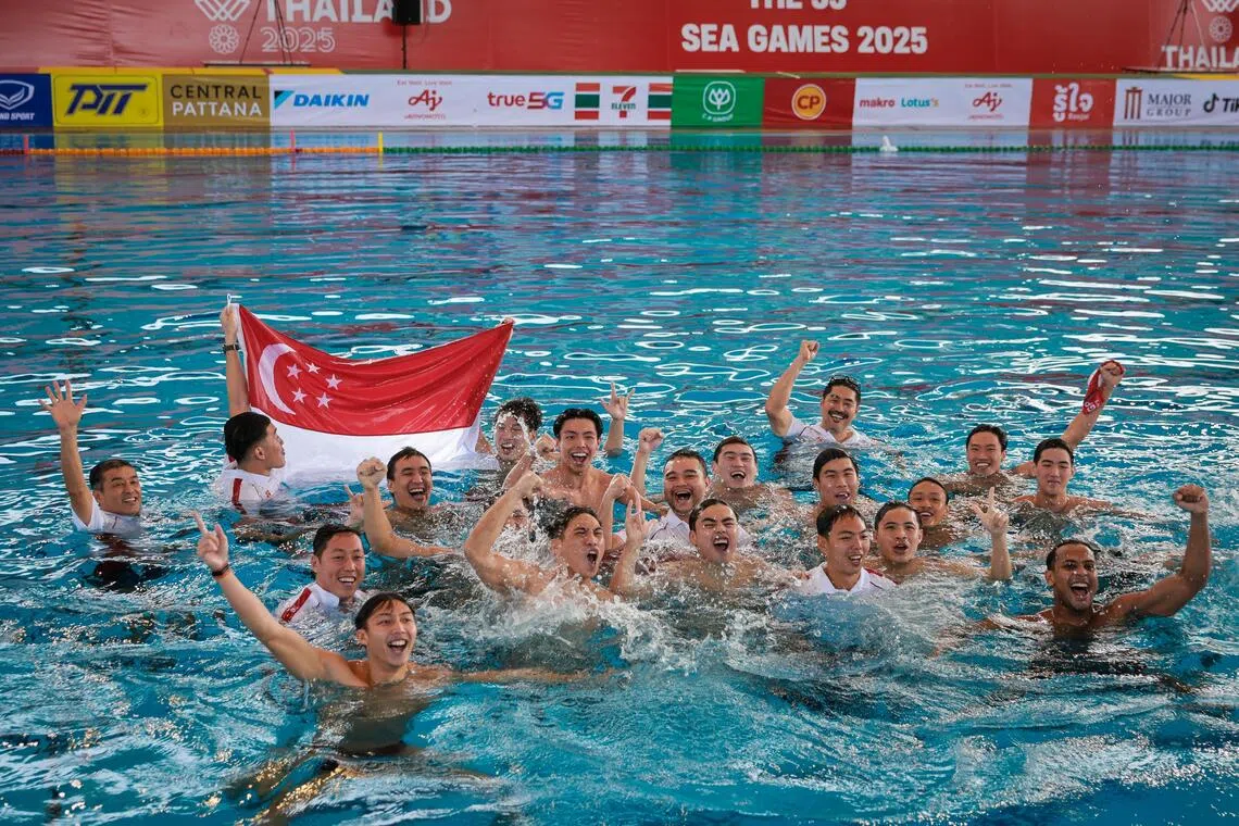 The Singapore water polo team celebrating after securing their SEA Games gold medal with a victory against Indonesia at the Thammasat Water Sports Center in Bangkok on Dec 19.