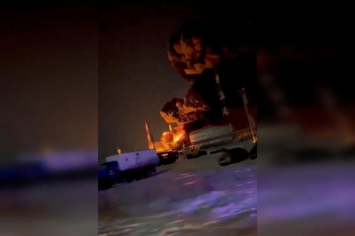 A fuel facility on fire in Oryol, Russia, after a supposed Ukrainian drone attack in December 2024.