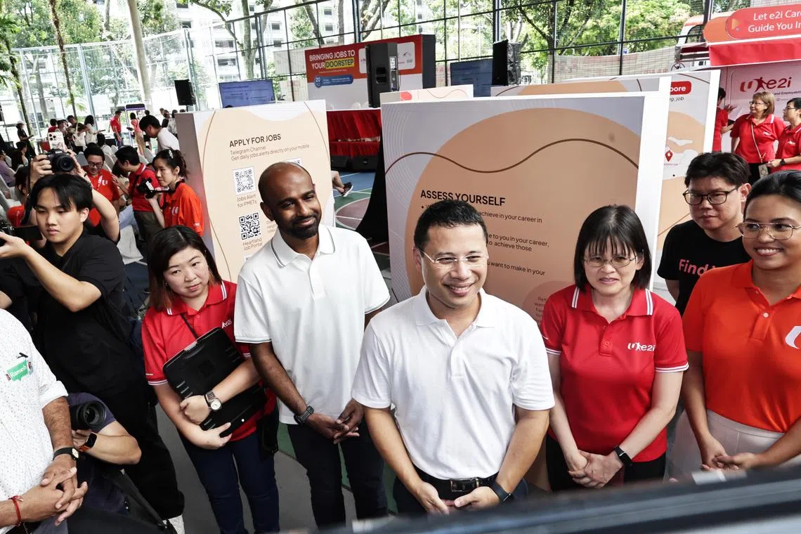 Minister for National Development Desmond Lee (centre) with (from left) Mr Hamid Razak, NTUC assistant secretary- general Caryn Lim, and NTUC director for youth development Natasha Choy at Boon Lay Community Club on April 20. 