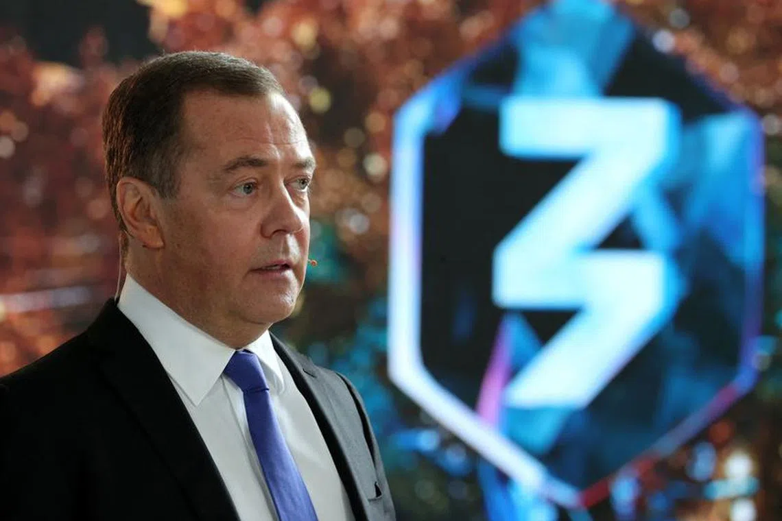 Deputy head of Russia's Security Council Dmitry Medvedev takes part in Znaniye educational marathon via a video link during a meeting with officials and employees of the military industrial corporation "Scientific and Production Machine Building Association" in the town of Reutov in the Moscow region, Russia, April 25, 2023. Sputnik/Yekaterina Shtukina/Pool via REUTERS/File Photo