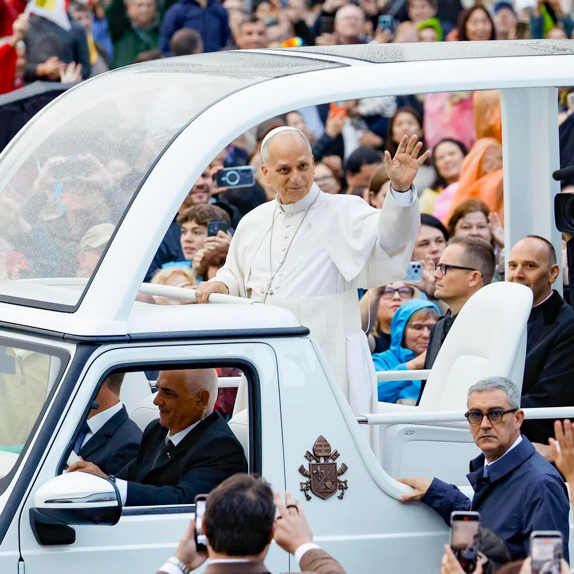 Pope Leo greets the faithful during his weekly general audience in Vatican City on Oct 21.