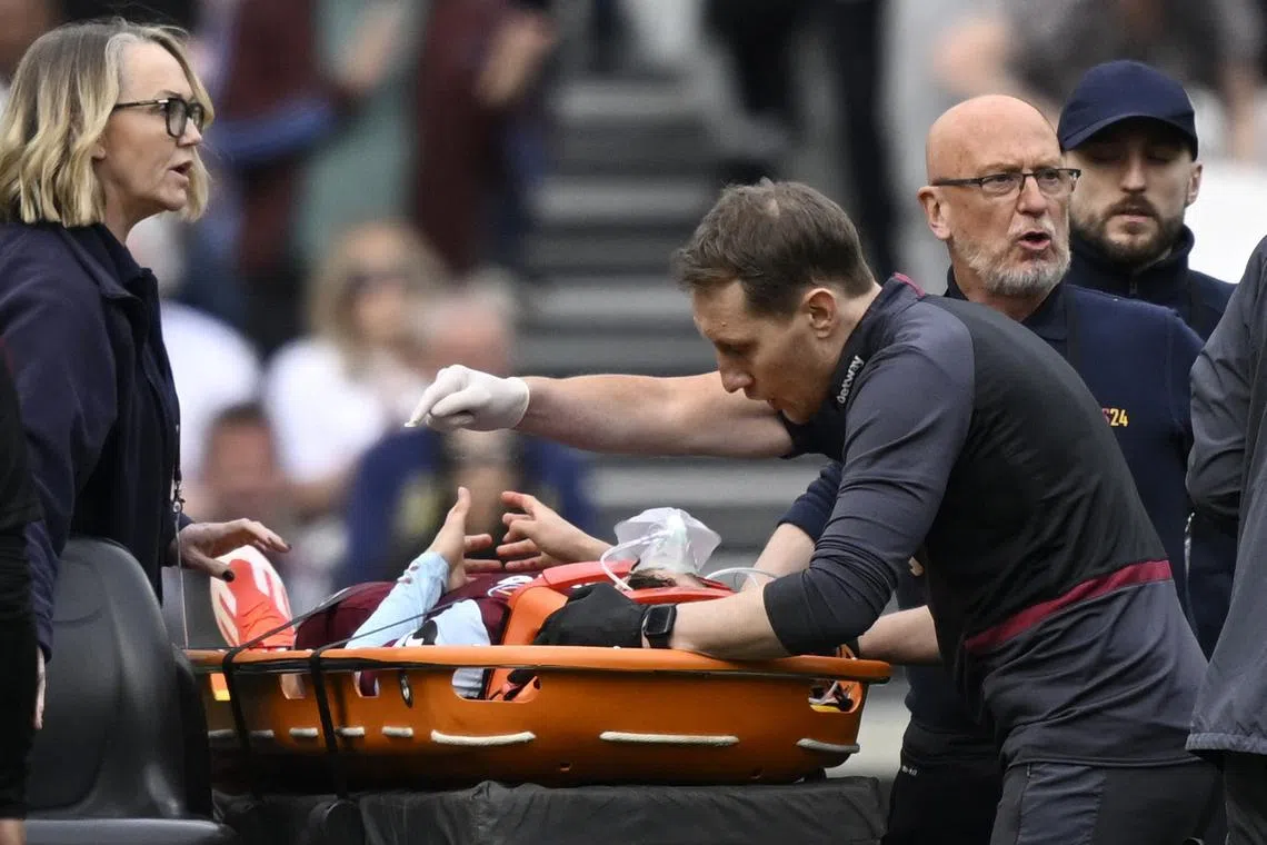 Soccer Football - Premier League - West Ham United v Fulham - London Stadium, London, Britain - April 14, 2024 West Ham United's George Earthy is stretchered off after sustaining an injury REUTERS/Tony Obrien