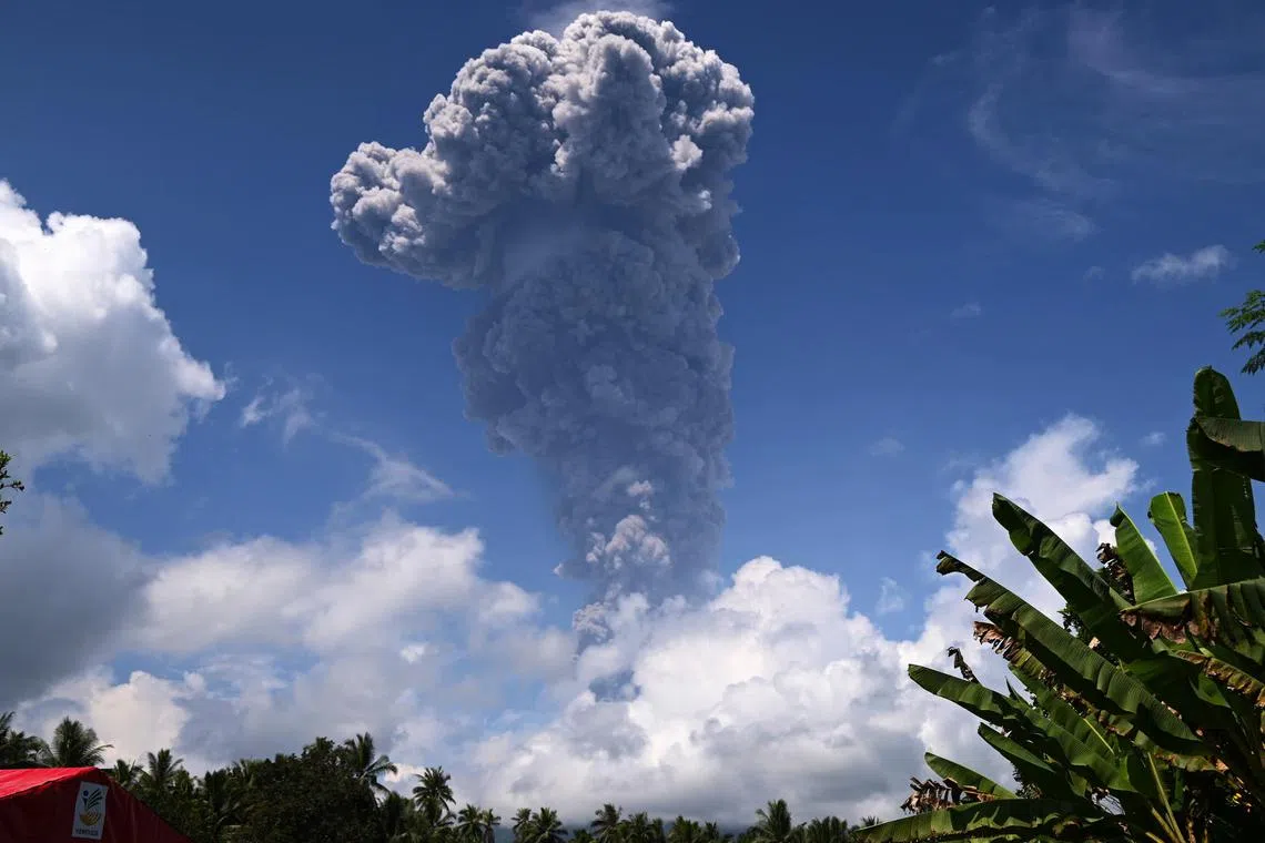 Thick grey ash and dark clouds spewed from Mount Ibu in North Maluku province, Indonesia on May 15.