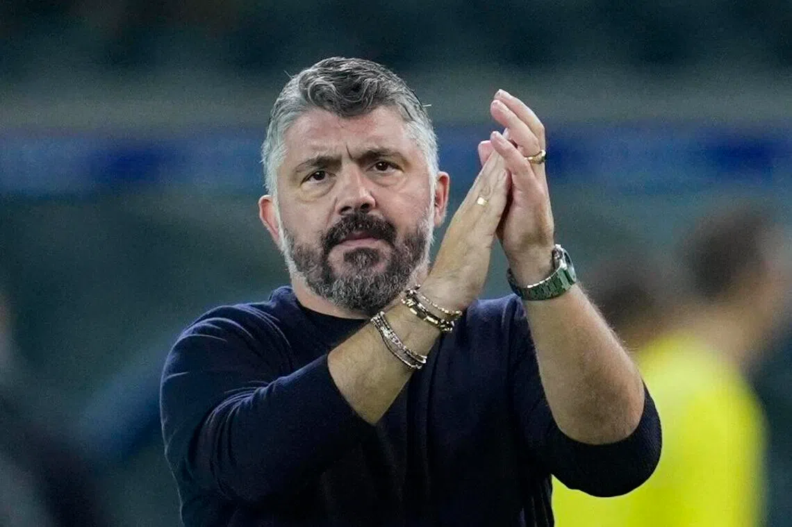 Italy coach Gennaro Gattuso applauds fans after the match.