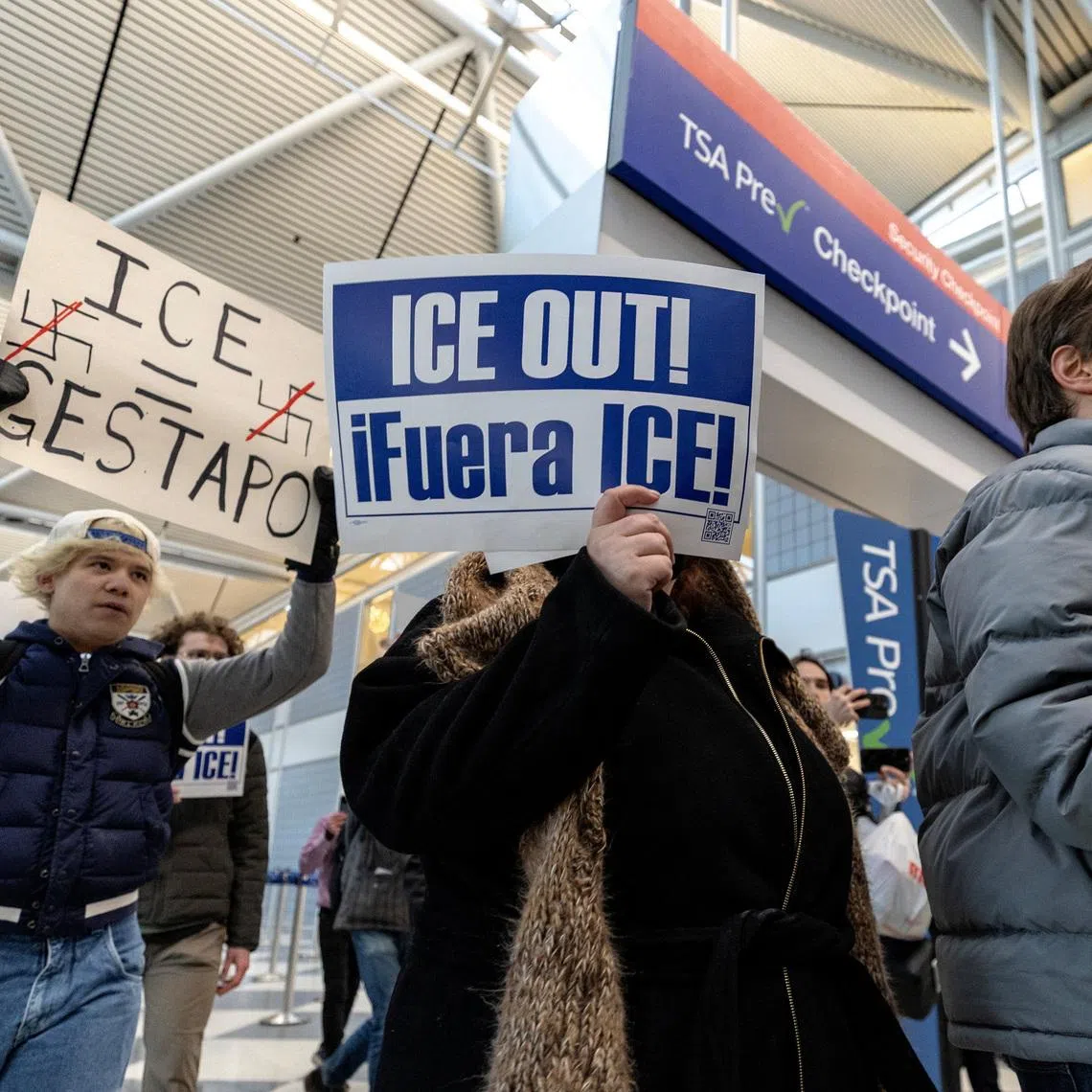 Anti-ICE protesters march through Terminal 1 of O’Hare International Airport, as they call for the removal of ICE agents ordered to help with security at airports earlier in the week on Monday, March 23, in Chicago, Illinois, U.S., March 27, 2026. REUTERS/Jim Vondruska