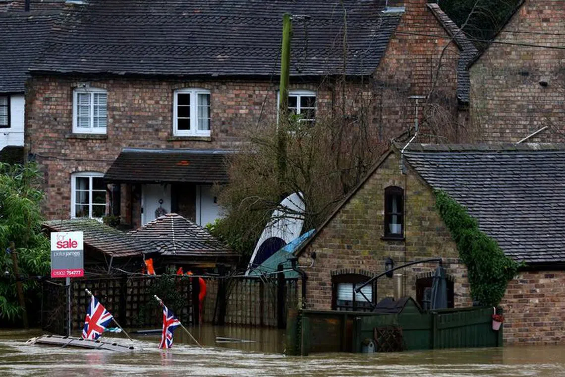 FILE PHOTO: A home is surrounded from flood water from the River Severn after heavy rain from Storm Henk, Ironbridge, Britain, January 4, 2024. REUTERS/Carl Recine/File Photo