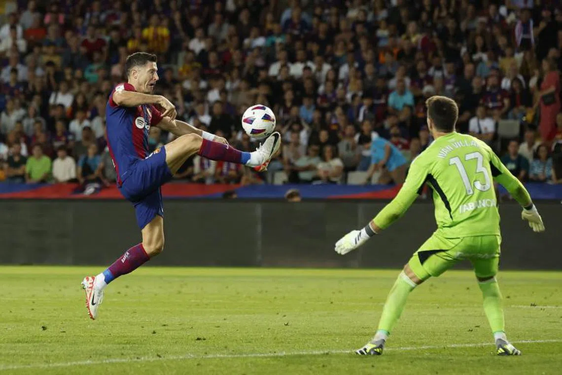 Soccer Football - LaLiga - FC Barcelona v Celta Vigo - Estadi Olimpic Lluis Companys, Barcelona, Spain - September 23, 2023 FC Barcelona's Robert Lewandowski scores their first goal REUTERS/Albert Gea