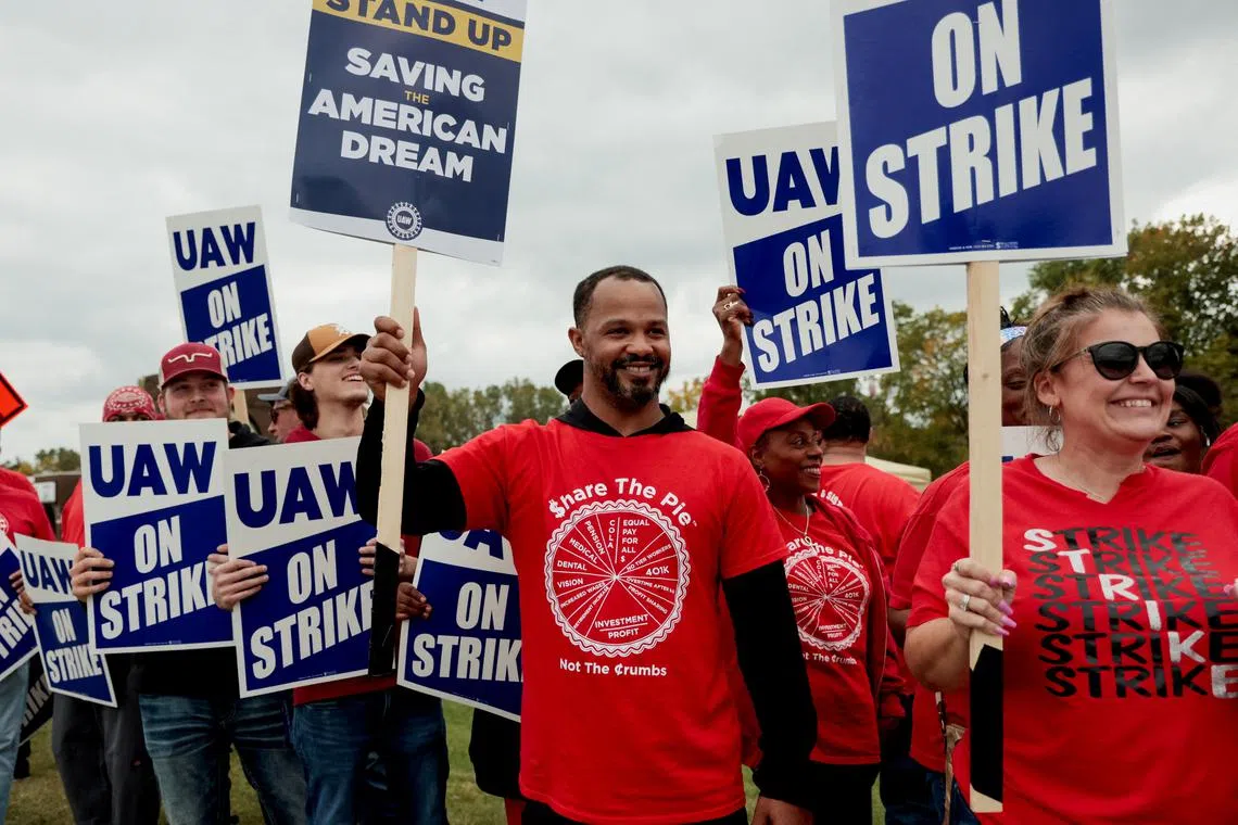 Striking United Auto Workers members from the General Motors Lansing Delta Plant picket in Delta Township, Michigan, on Sept 29.