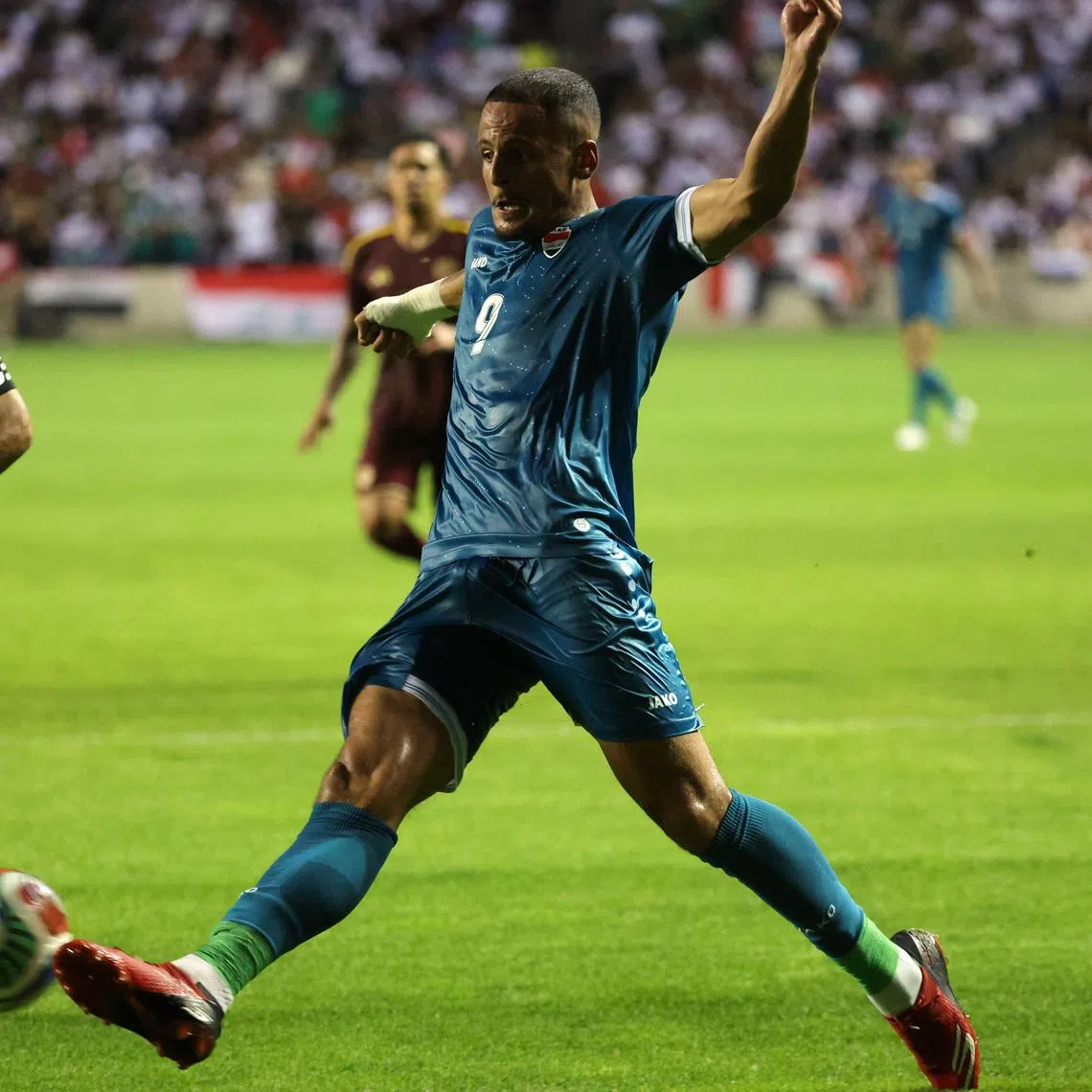 Jun 9, 2026; Bridgeview, Illinois, USA; Iraq forward Ali al-Hamadi (9) kicks the ball against Venezuela during the first half at SeatGeek Stadium. Mandatory Credit: Mike Dinovo-Imagn Images