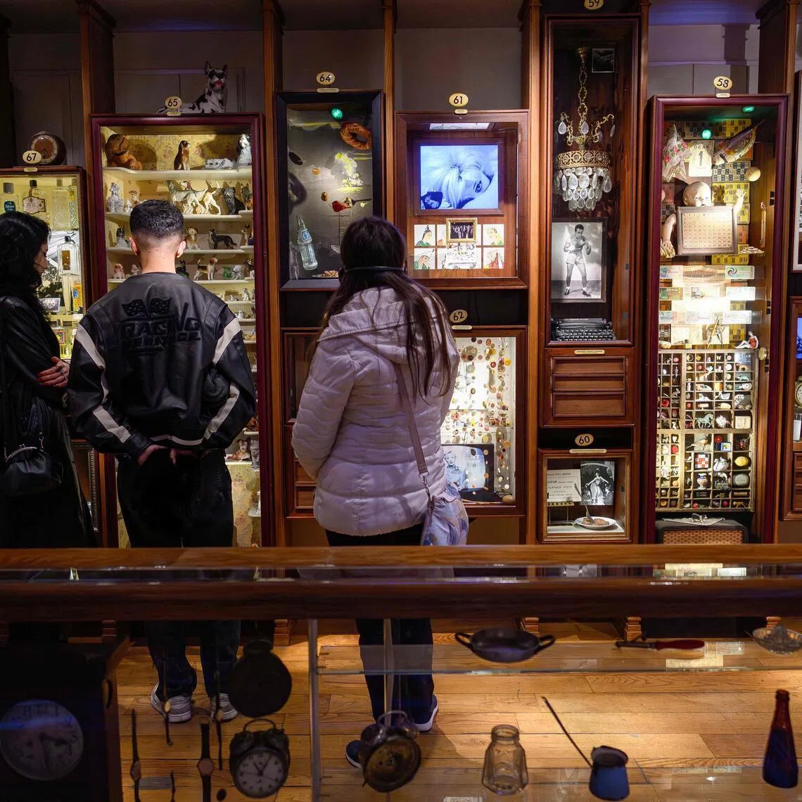 Visitors look at the display cases in The Museum of Innocence in Istanbul on Feb 10.