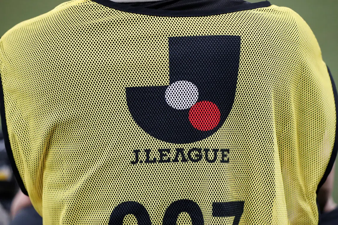 FILE PHOTO: Soccer Football - J2 League - Tokyo Verdy v FC Machida Zelvia - Ajinomoto Stadium, Tokyo, Japan - June 27, 2020. The J.League logo is seen on a photographer's bib, as play resumes behind closed doors following the outbreak of the coronavirus disease (COVID-19).  REUTERS/Issei Kato/File Photo
