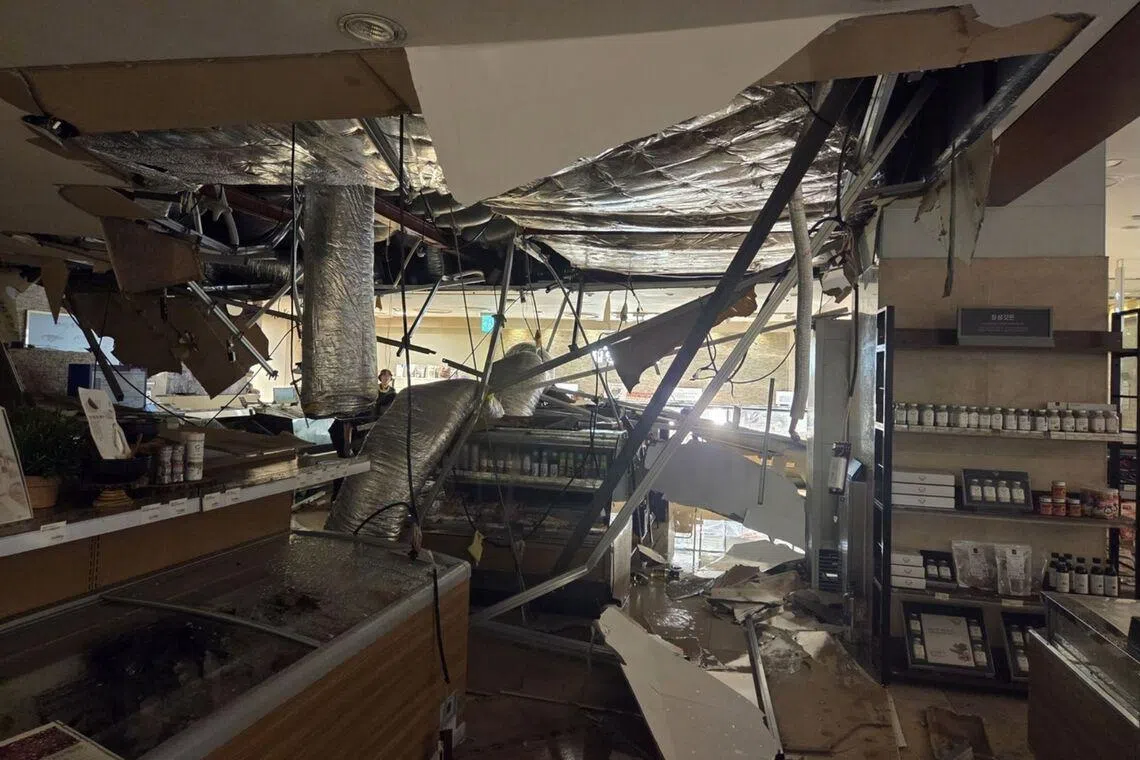 A section of the first basement floor ceiling collapsed, causing water to gush from above and flood the area below.