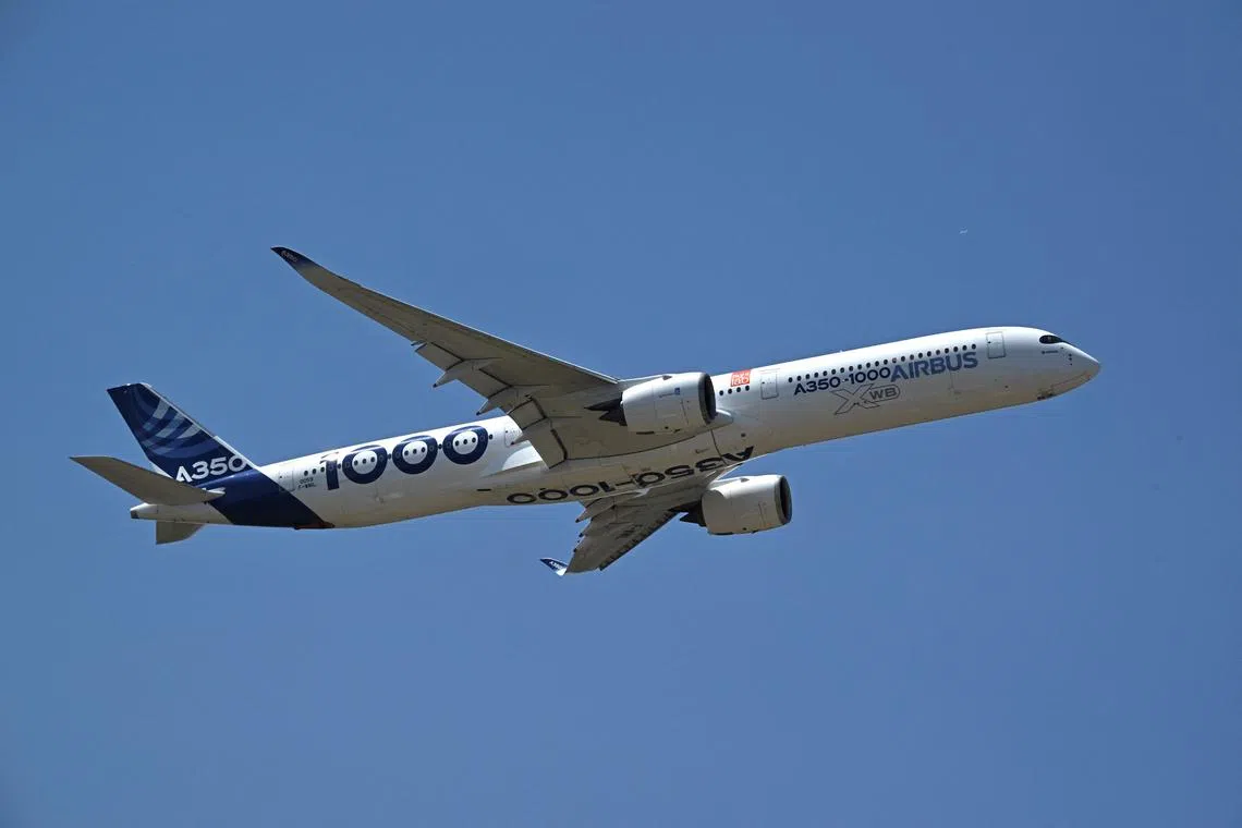 Airbus A350-1000 passenger aircraft performs during an exhibition flight demonstration as the Paris Air Show on June 18, 2025. 